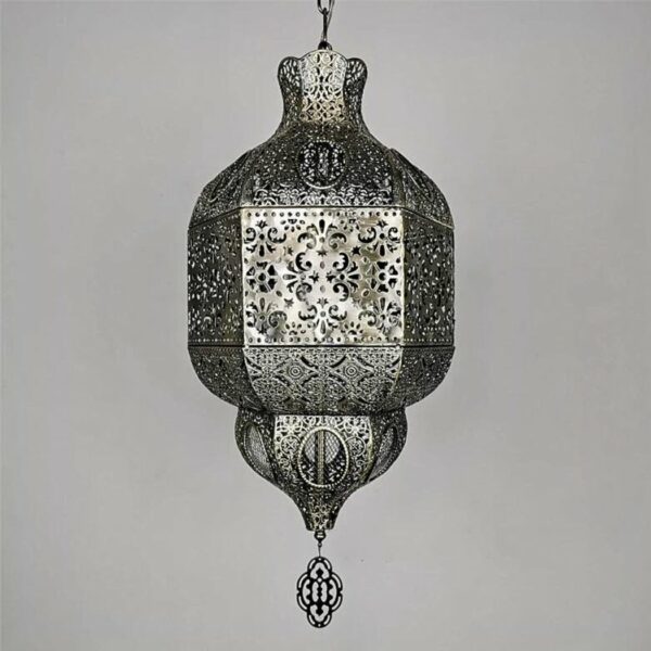on a light grey background, we see a metal suspension carved in the Moroccan style