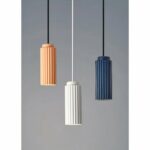 on a light background we see 3 Scandinavian-style pendant lights in different colors: white, pink and duck blue