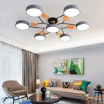 Wood and metal Scandinavian-style adult bedroom chandelier hanging from the ceiling of a living room and in its gray version.